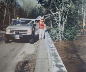 USGS technicians, Len Reed and Mike DeVolder, measuring the flood peak on the Tualatin River at West Linn on February 10, 1996.