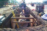 trench dig with an exposed pipe